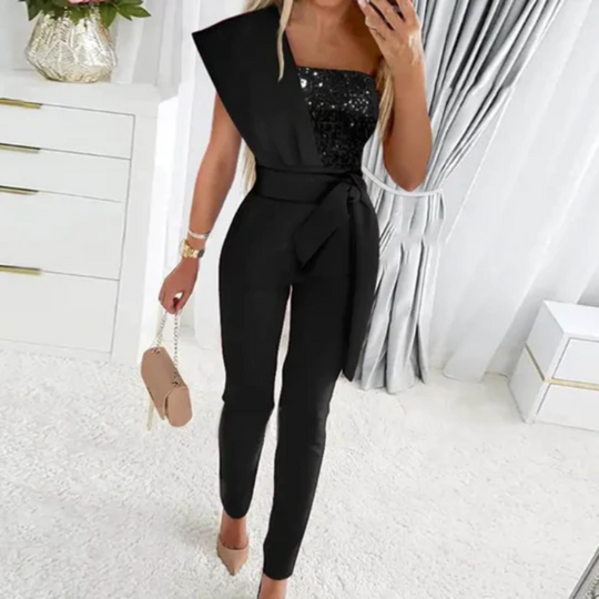 Zwarte feestelijke glitter jumpsuit, compleet met high waist pants en een sprankelende glitter top